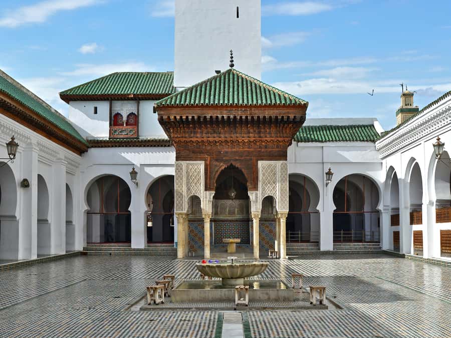 Fes: Royal Palace, Madrasa, Tannery & Souks and Medina Tour - Mellah and Bou Inania Madrasa: reading Fez through faith and craft